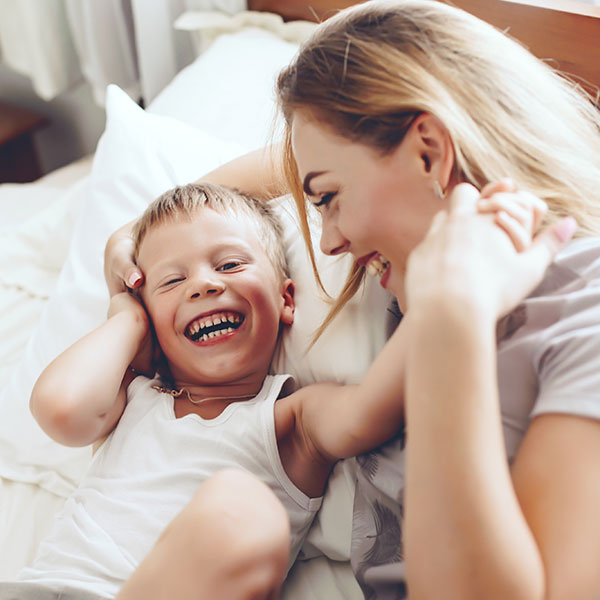 Son and Mother Laughing Together